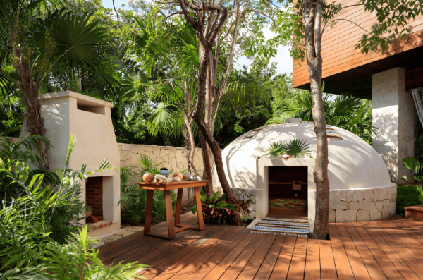 mayan temezcal treatment setting eith clay hut